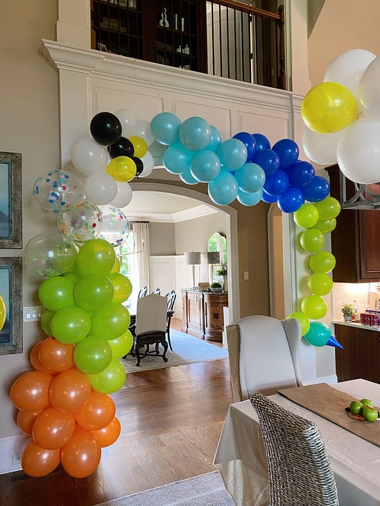 critter balloon arch with caterpillar, ant, and daisy