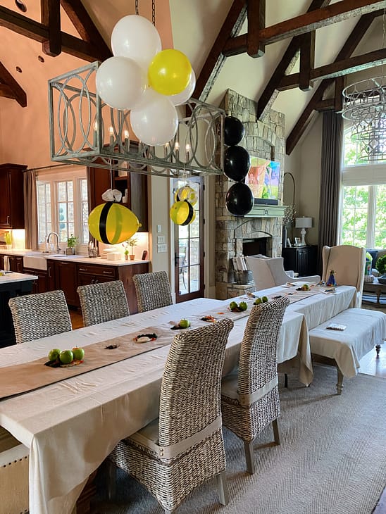 critter table decorations with apples, gummy worms, crushed oroes, and edible moss