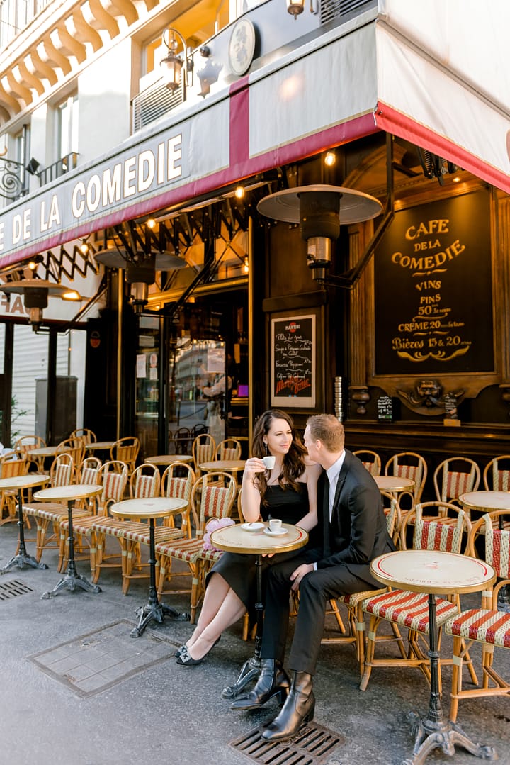 dina and Scott sipping espressos at  café la comedie: photoshoot in Paris