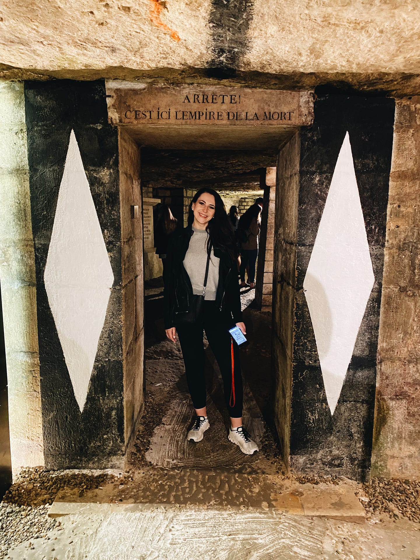 Entrance to the Catacombs of Paris.
Top: Coach
Joggers: Banana Republic 
Jacket: Rick Owens  
Handbag: Celine 
Shoes: On Cloud