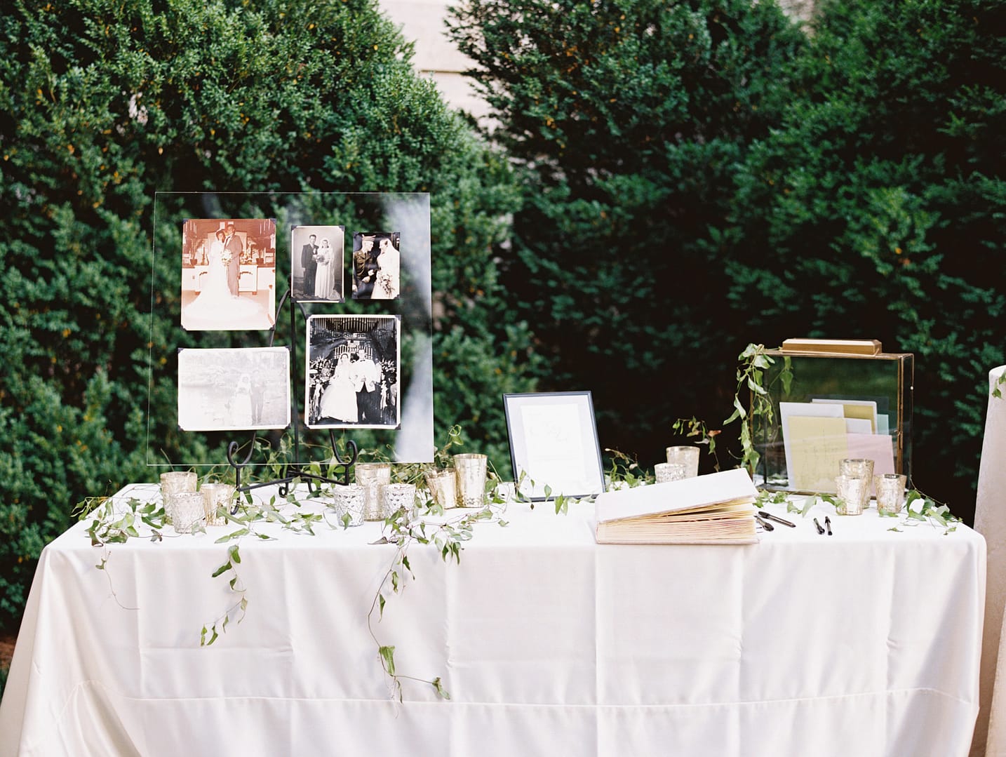 table with wedding photos of parents